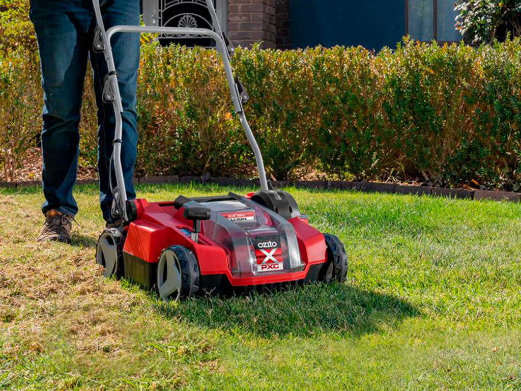  A man is scarifying his garden